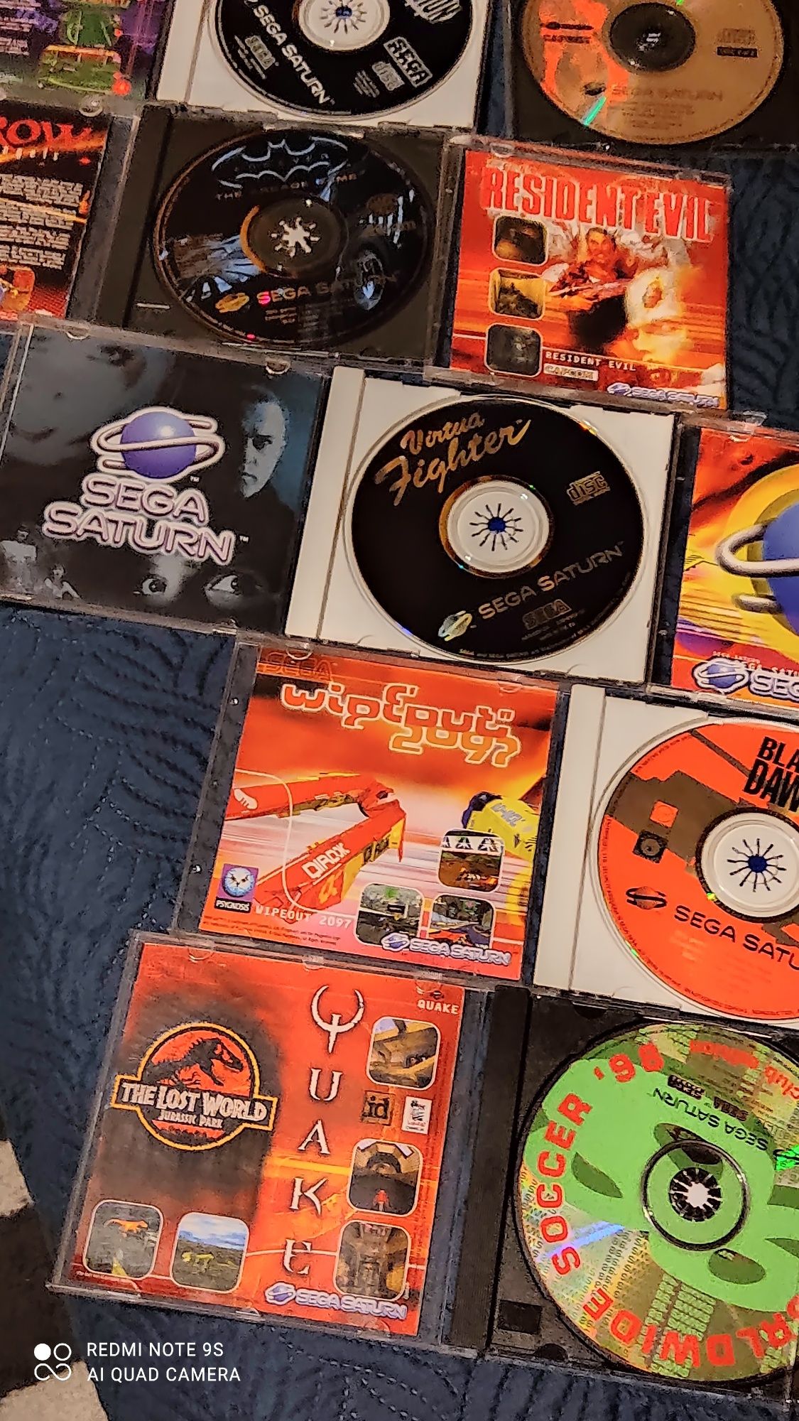 Sega Saturn com caixa e vários jogos