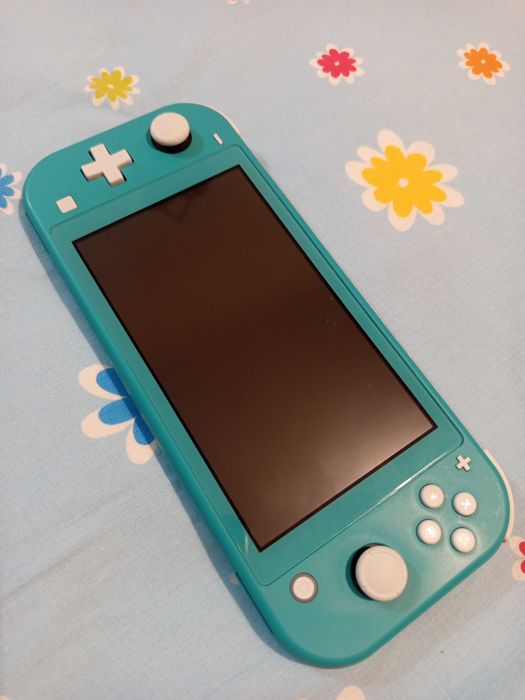 Nintendo Switch Lite + 3 Jogos