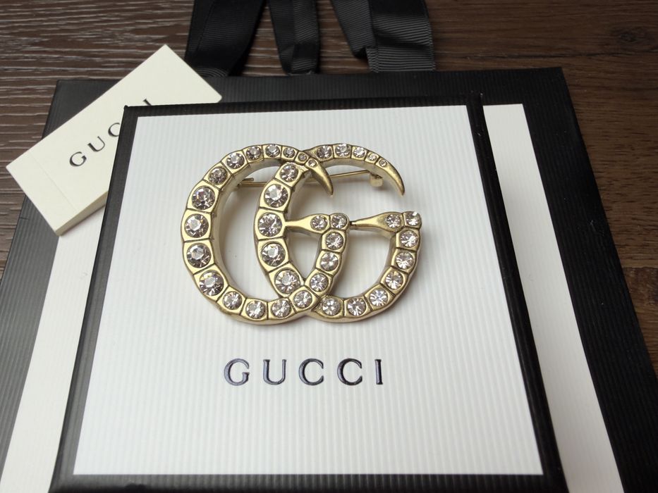 Broszka Gucci stare złoto z cyrkoniami