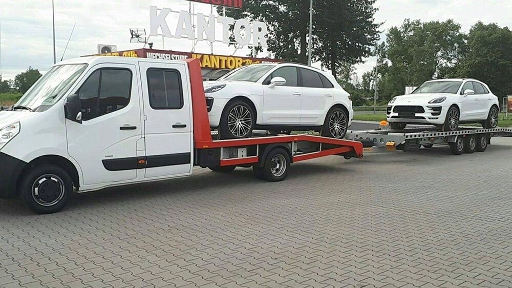 Transport samochodów aut z Niemiec Polska laweta Śląsk holowanie bus
