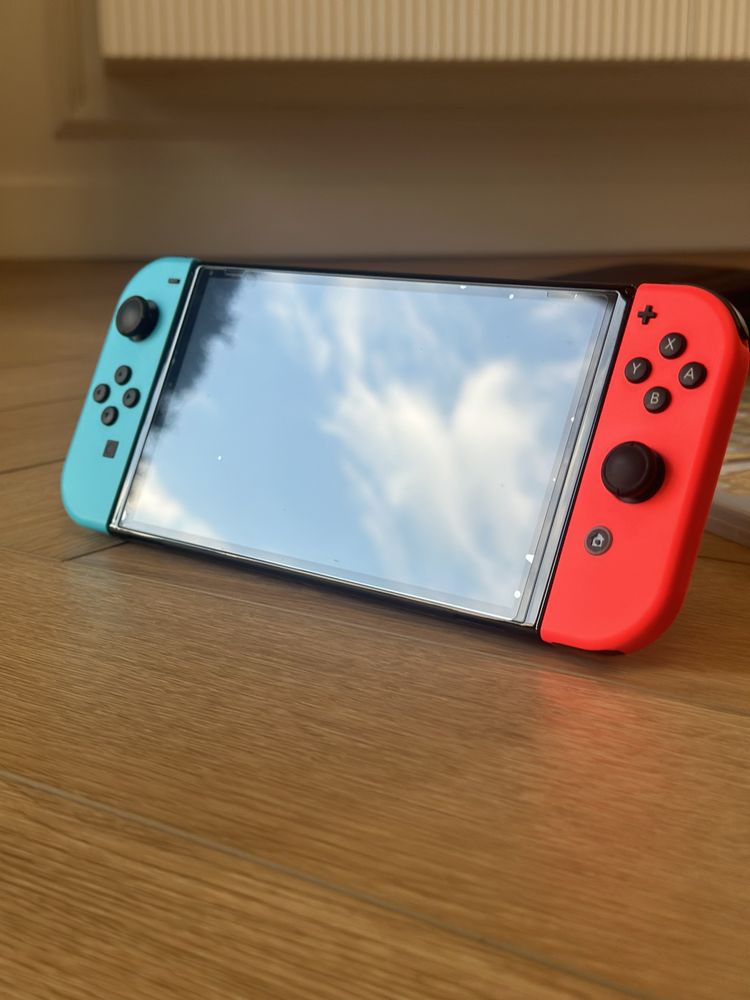 Nintendo switch OLED + gry i etui