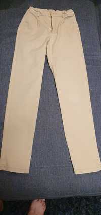 Chłopięce beżowe spodnie chinosy Cocodrilo elegant rozmiar 146