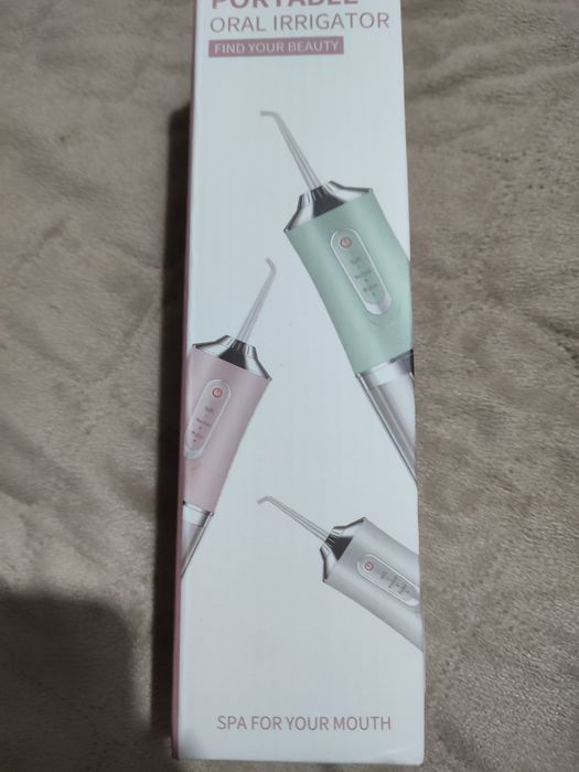 Irrigador oral elétrico portátil