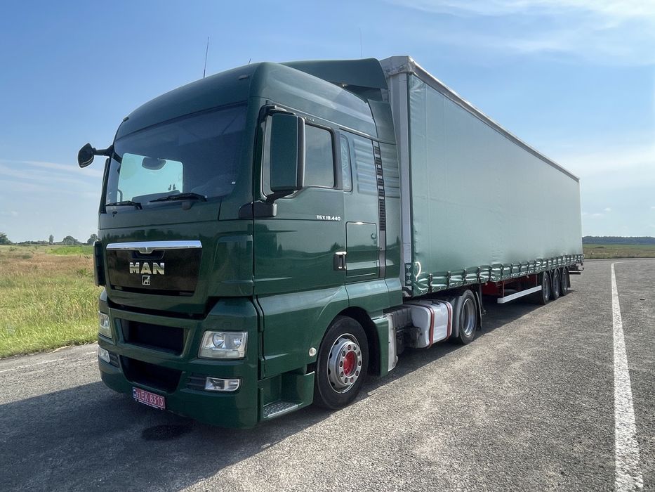 Тягач Man TGX 18.440 MEGA + напівпричіп штора Kassbohrer осі SAF