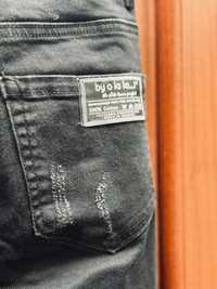 Spodnie jeansy z dziurami czarne BY O LA LA