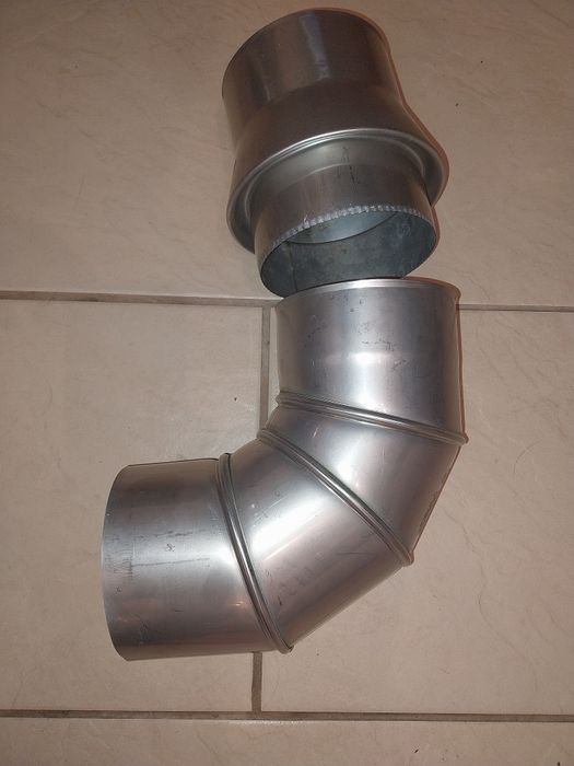 Kolano  fi 130 z odskraplaczem poziomym