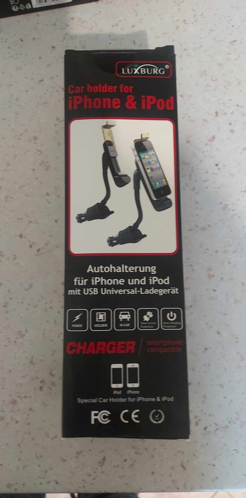 Sprzedam uchwyt samochodowy do iPhone z ładowarka umiwersalną