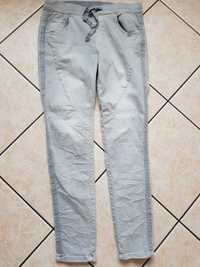 Błękitne cieniowane ombre spodnie dla wysokiej lampas r. L XL jeans