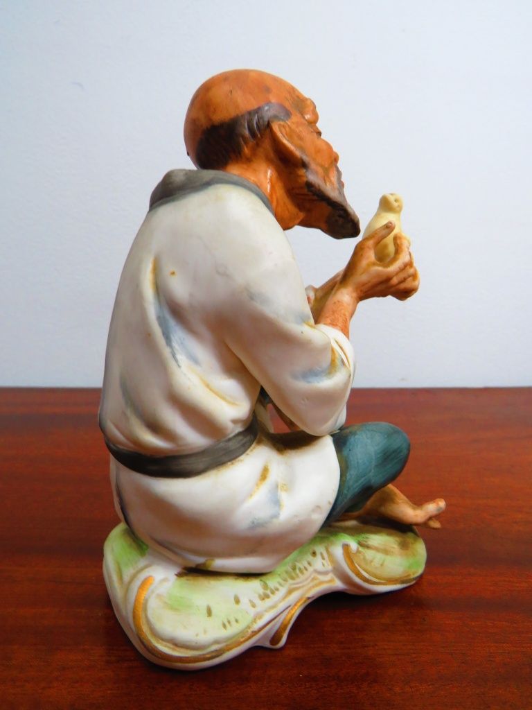 Par de anciãos chineses em cerâmica fina.
