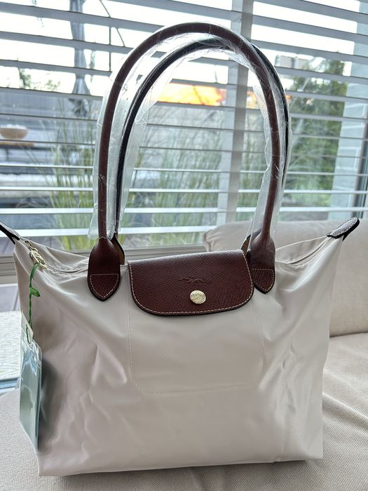 Longchamp biała/papier roz. M