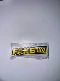Autocolante “Fake Táxi” 100mm