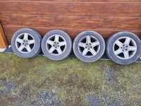 Felgi aluminiowe alufelgi 5x100 Volkswagen R15 Golf IV z oponami lato