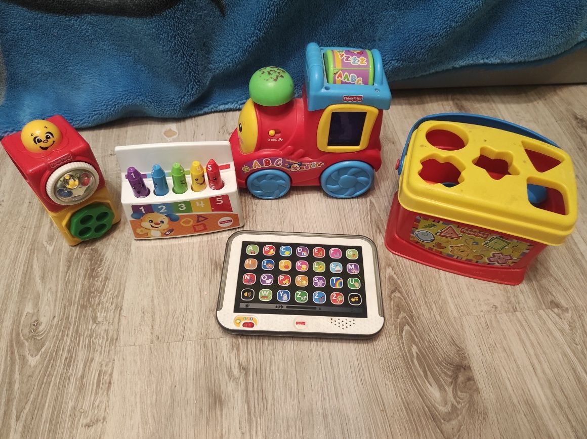 Fisher Price grające zabawki ciuchcia sorter klocki tablet kredki