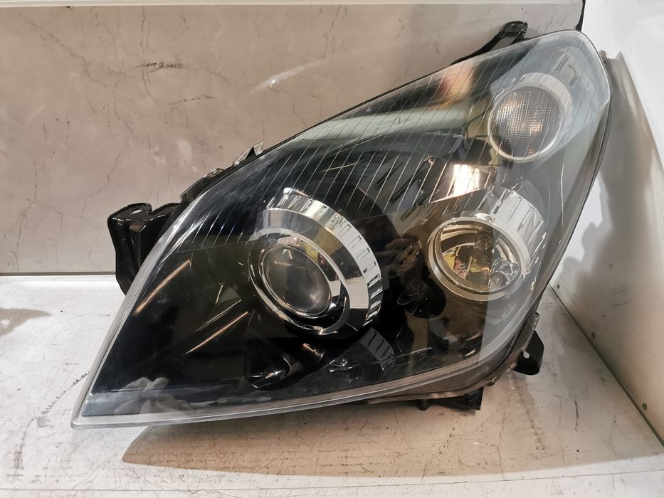 Stan BDB Lampa Bi Xenon lewa lewy Opel Astra H III Europa