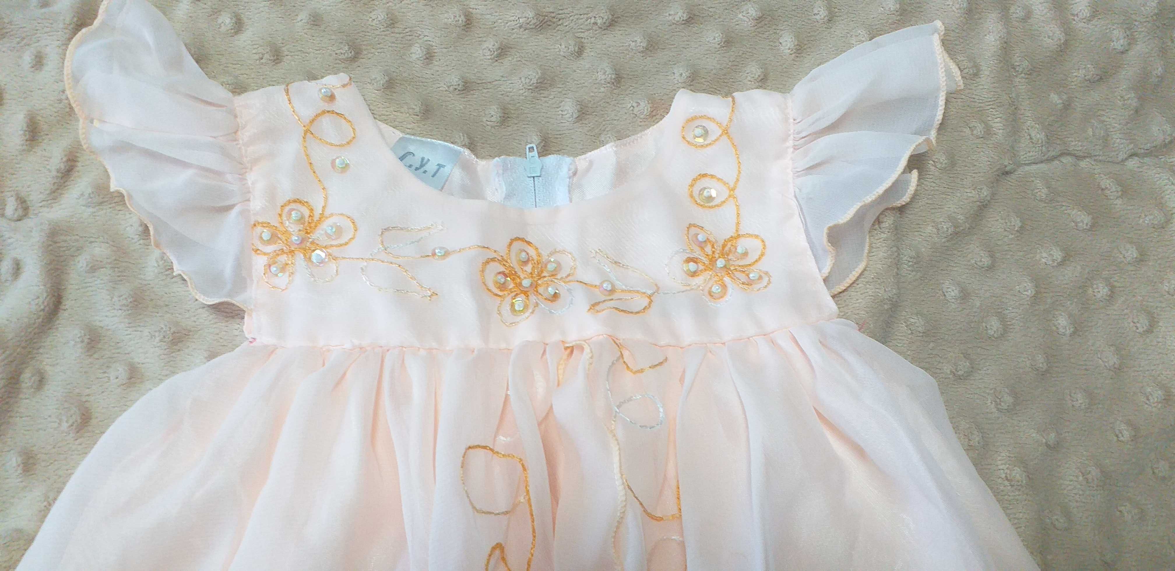 Sukienka niemowlęca w kolorze brzoskwiniowym roz. 2  ok. 70 cm.