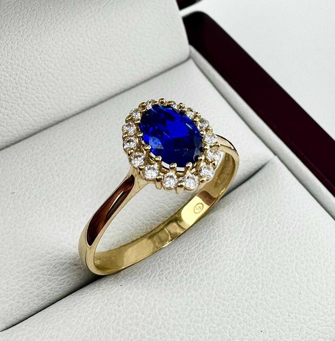 Złoty pierścionek z granatowym oczkiem 2,42g 585 14K R. 20