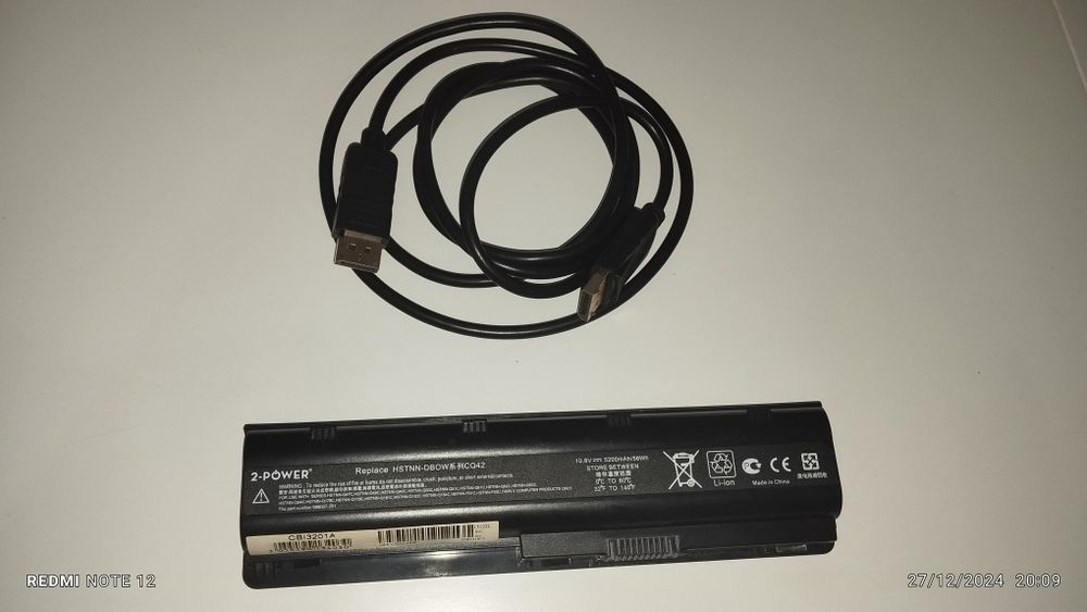 Bateria HP e um cabo para gráfica em bom estado