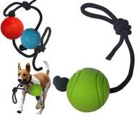 Piłka dla psa na sznurku  gumowa średniotwarda plastyczna 7 cm zielona