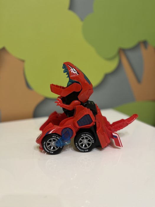 Музична машинка трасформер Динобот динозавр