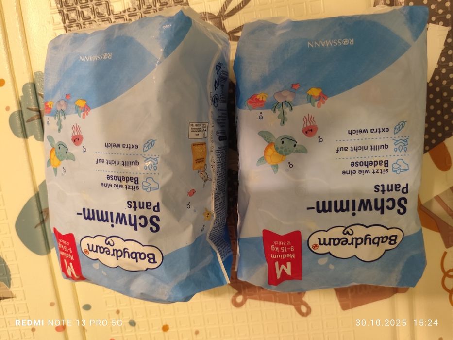 2 paczki pieluch do pływania  M