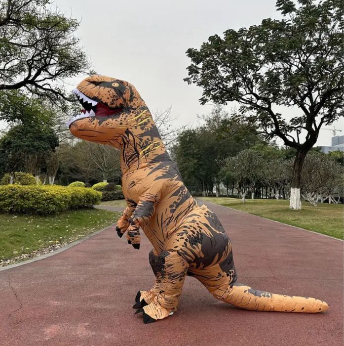 Оренда, прокат надувного костюма динозавр помаранчевий