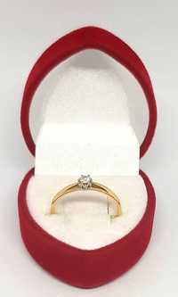 Złoty pierścionek z Brylantem 0,08ct PR.585 W:1,51gr R.12 ,