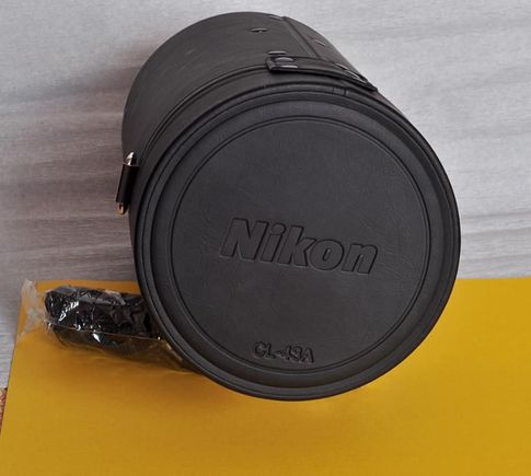 Nikon CL-43A tuba na obiektyw.
