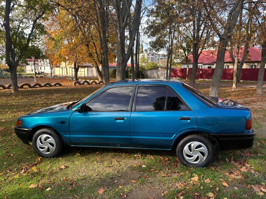 Mazda 323 расход 7л/100км
