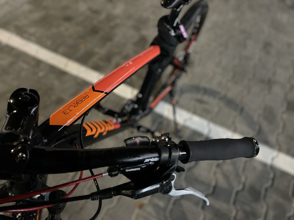 Велосипед 27,5" Pride Rebel 7.3 черный, оранжевый, красный 2017