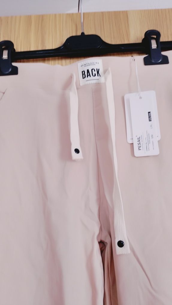Nowe beżowe spodnie tak zwane gumy, rozm L lXL