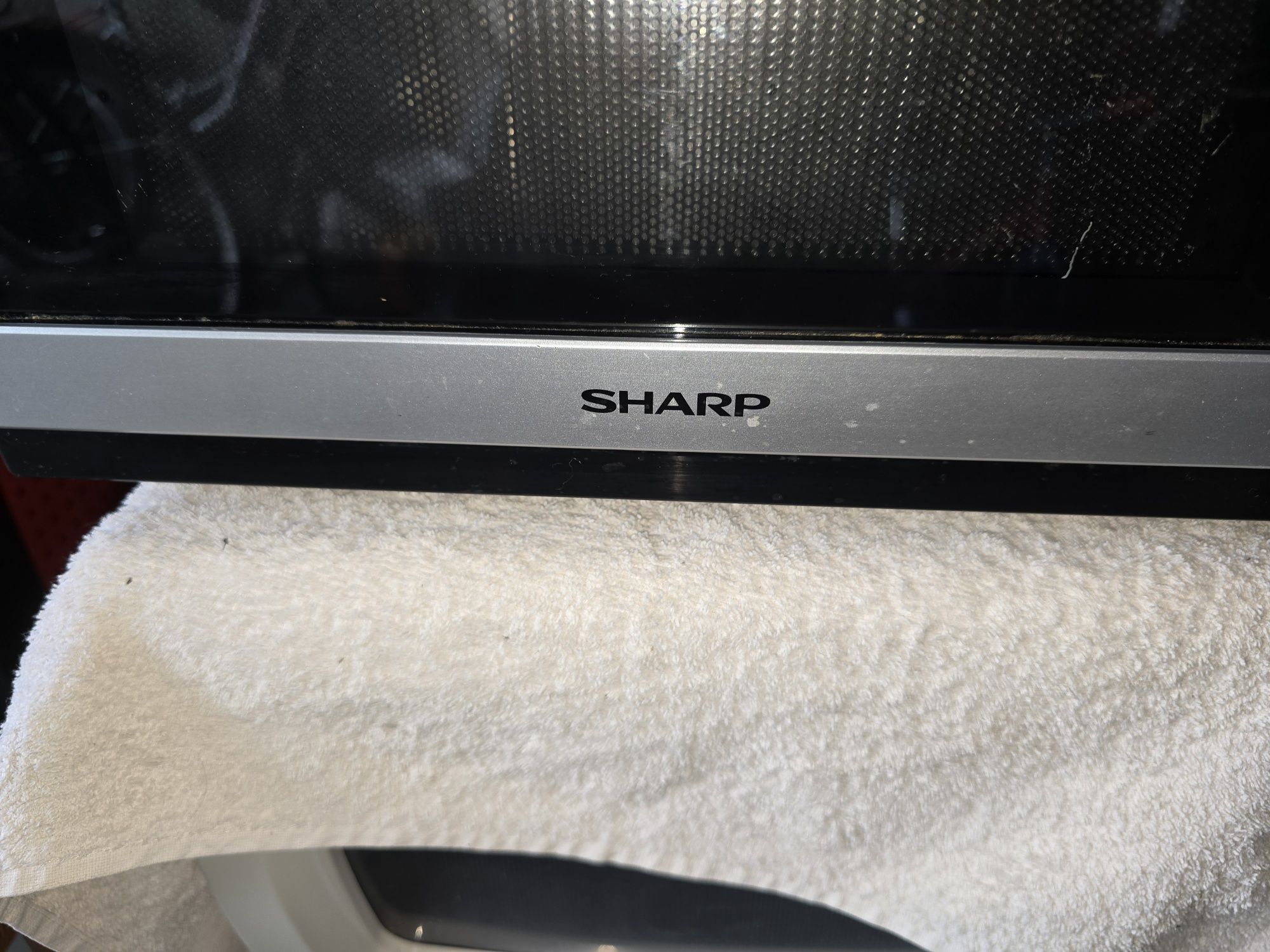 Sprzedam sprawną  kuchenkę mikrofalową Sharp z funkcją grill