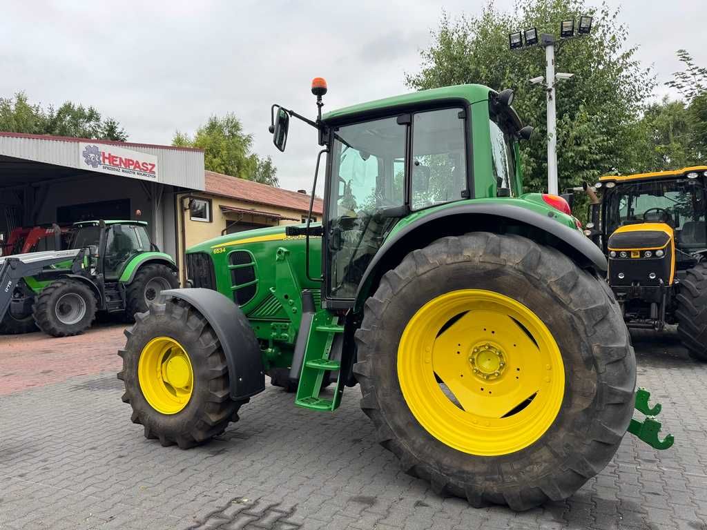 JOHN DEERE 6534 / Przednia oś amortyzowana TLS / PowrQuad Plus /