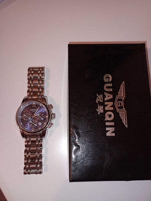 Годинник новий Guanqin