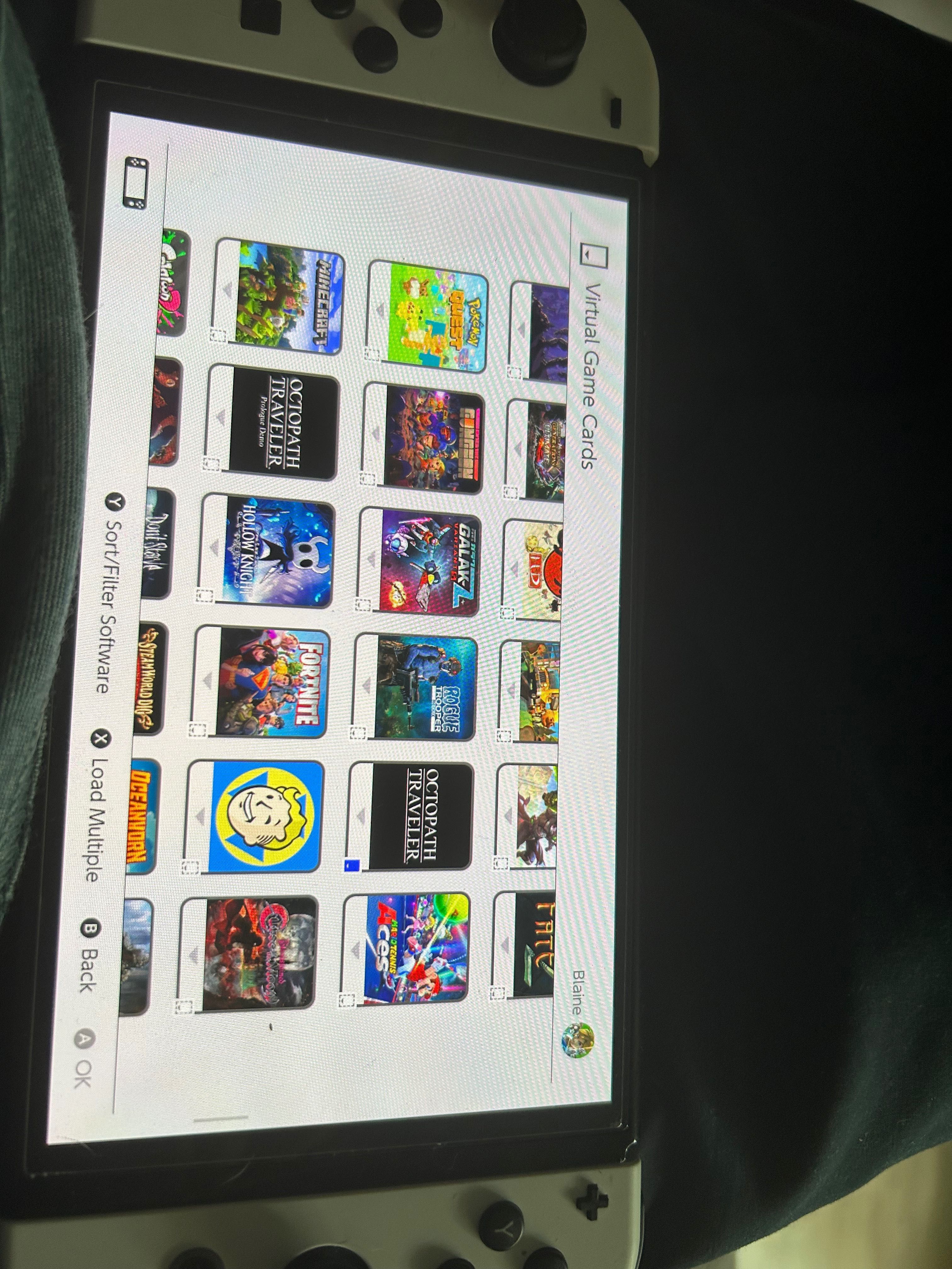 Nintendo Switch OLED + 3 gry w pudełku i 225 gier cyfrowych