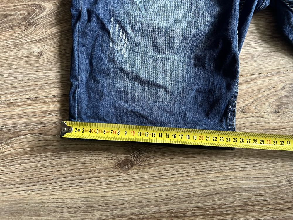 Krótkie spodenki dżinsowe marki DSQUARED, rozmiar  L