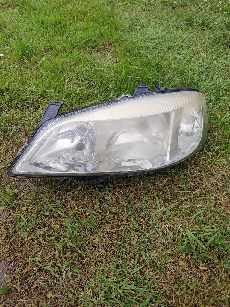 Lewy reflektor opel astra II g