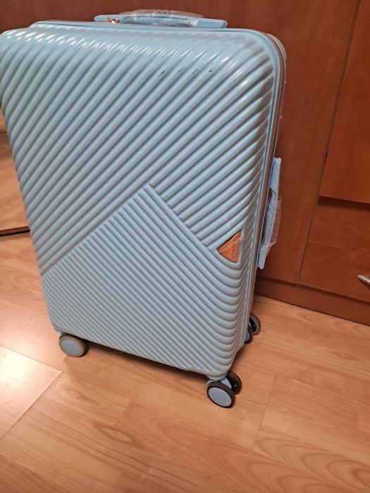 Walizka  na 4 kółkach, niebieska. 60/40/25.