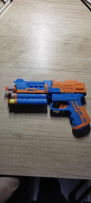 Игрушка пистолет