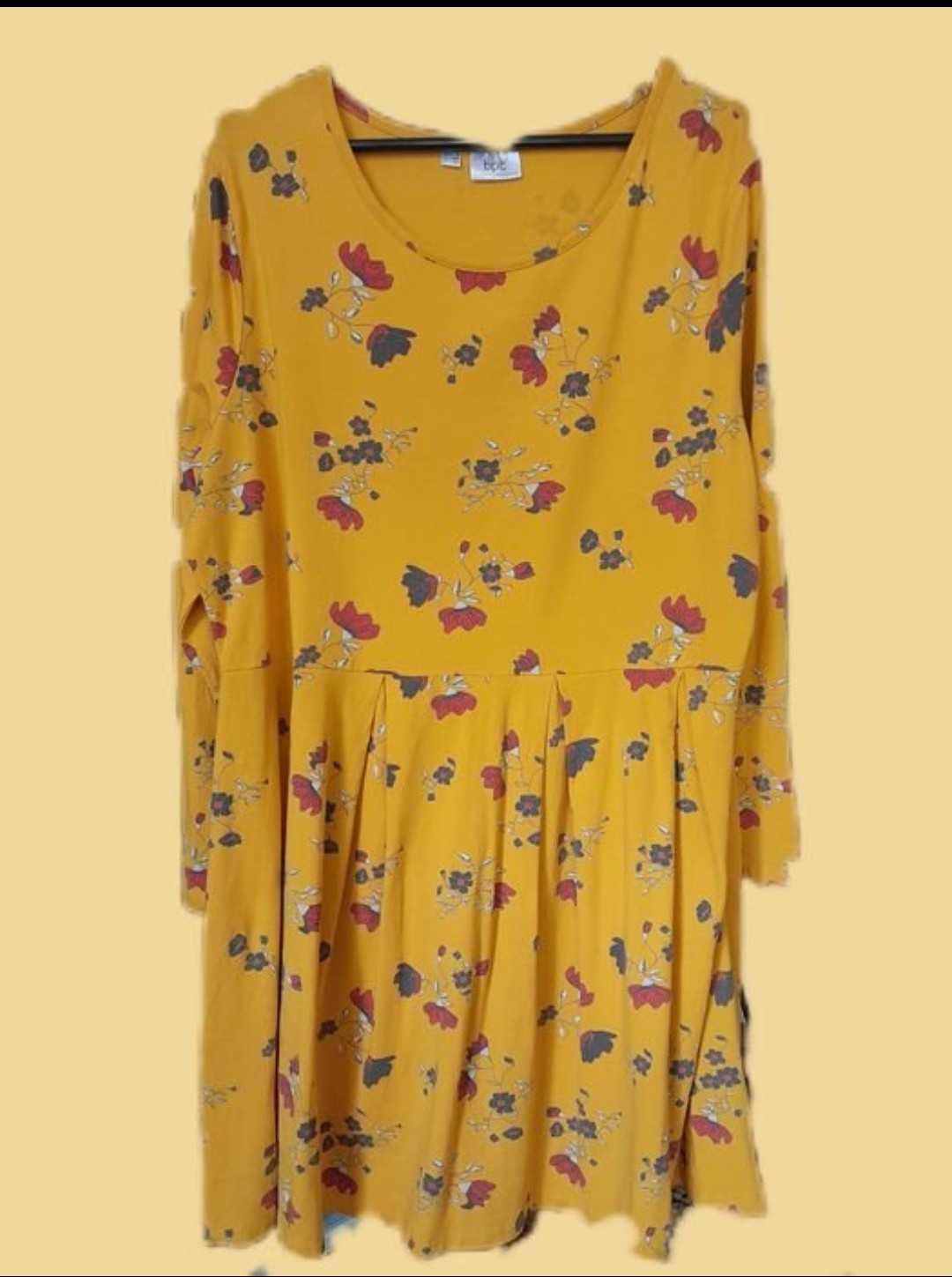 Musztardowa rozkloszowana sukienka w kwiaty Bonprix 48/50