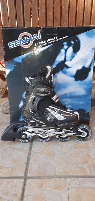 Nowe Łyżworolki rolki regulowane Senhai PW-125F czarne S 32-35 ABEC-7