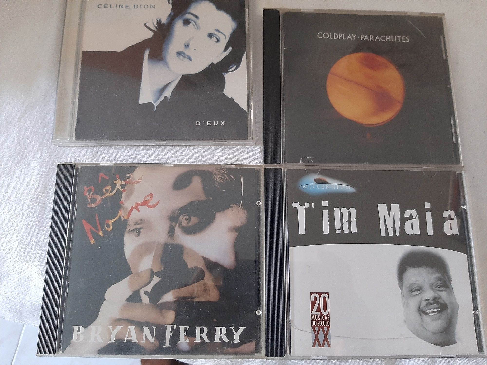 C. d. música originais como novos