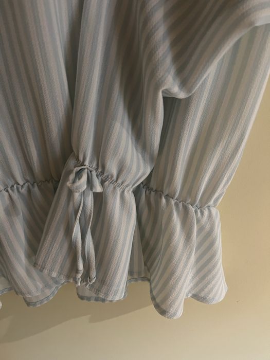 Blusa com folho de manga comprida