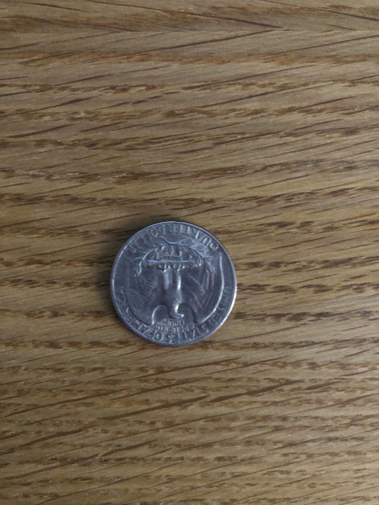 Moneta Quarter Dollar z 1966r obrócona o 180 stopnii, odwrotka
