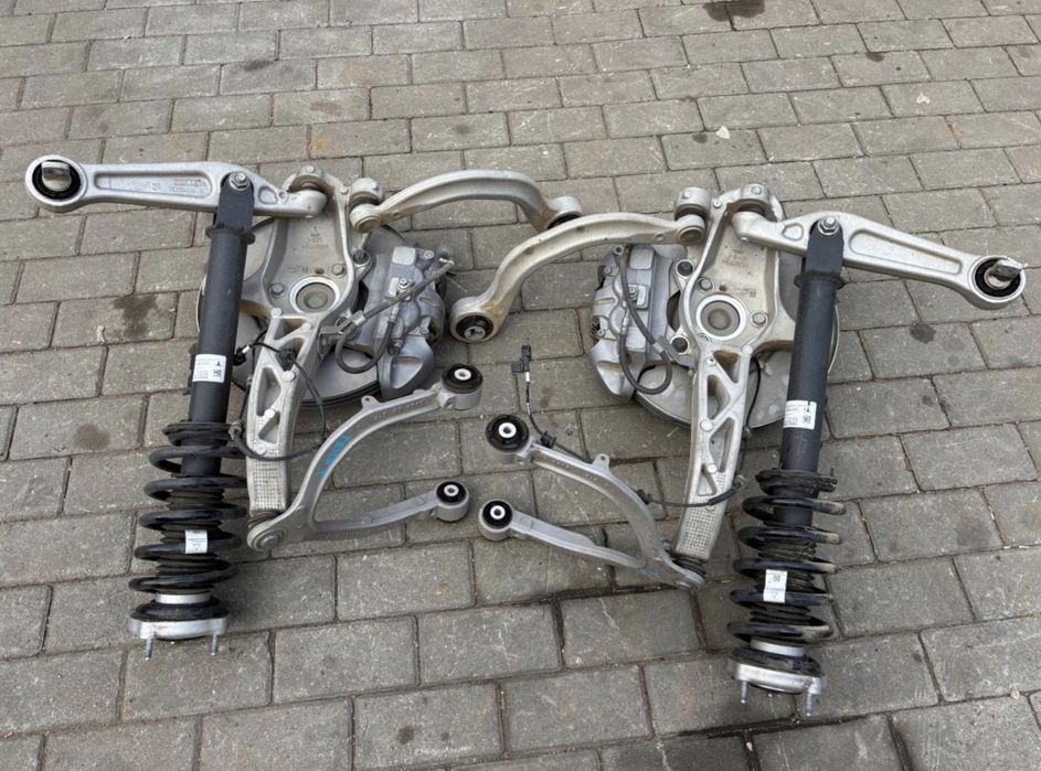 Tesla Model Y стійка, цапфа, ступиця, ричаг, супорт, диск