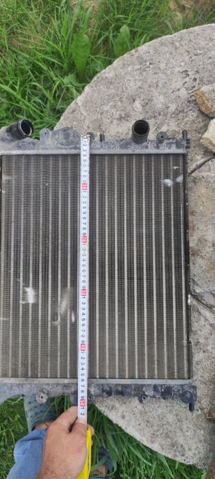 Радіатор, ліва цапфа Dacia Logan, Renault Logan