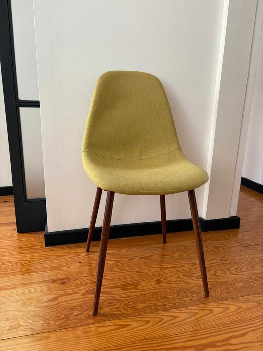 4 green chairs for a dining table