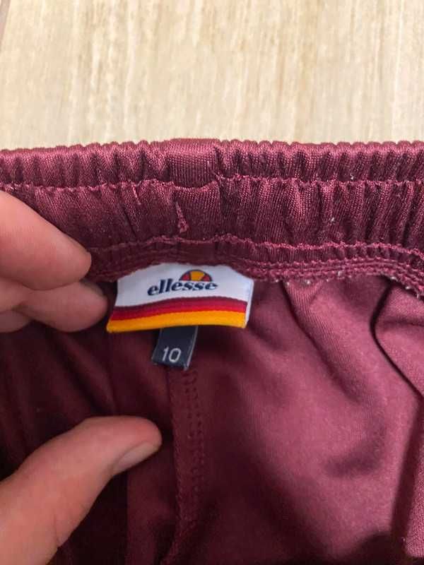 Damskie spodnie z szerokimi nogawkami Ellesse