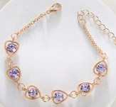 Pulseira dourada e roxa