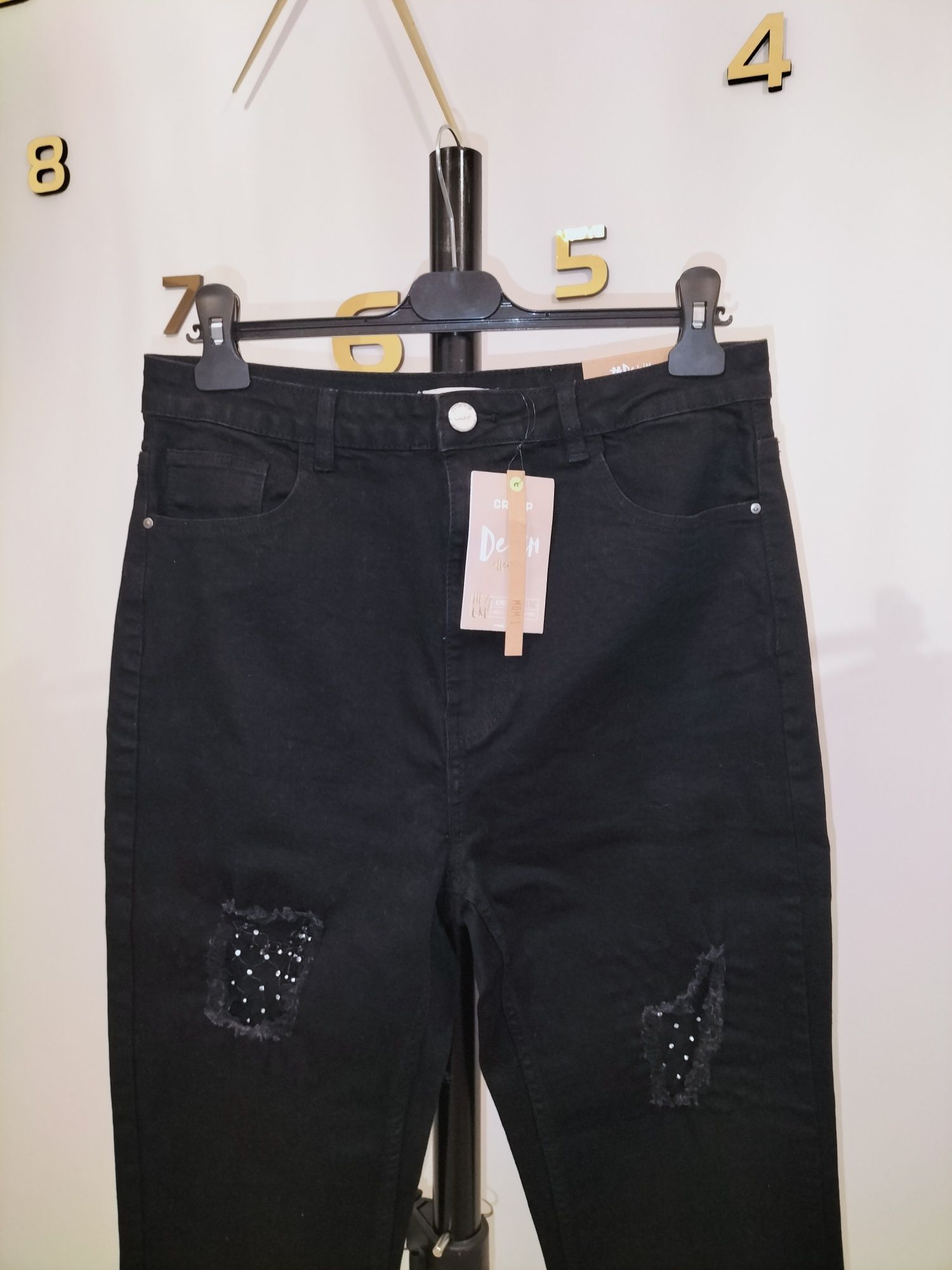 Nowe jeansy Cropp 42