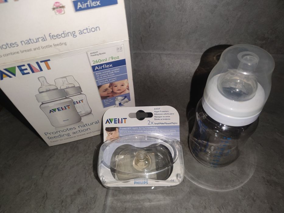 Новенькі Авент пляшечка та накладки для годування